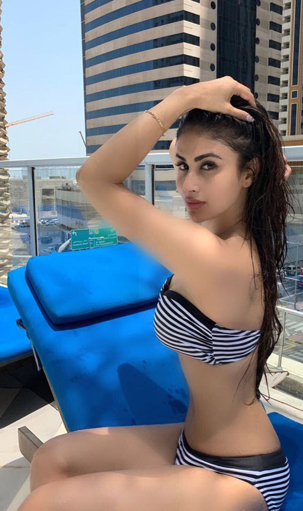 HOTNESS! Mouni Roy sets the temperature soaring in a striped bikini :  Bollywood News - Bollywood Hungama