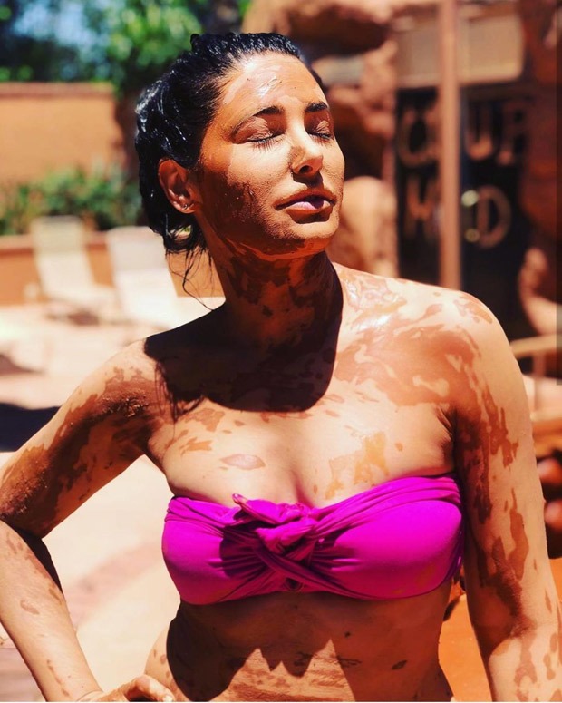 Nargis Fakhri soaks in the sun in pink bikini while enjoying mud bath 