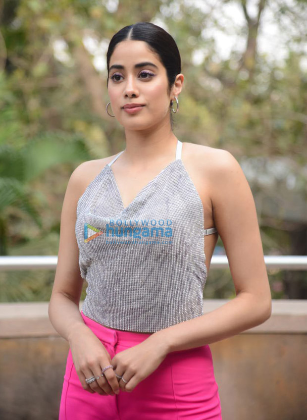 Janhvi Kapoor follows dopamine fashion trend in backless shimmery tip and pink pants for Roohi promotions