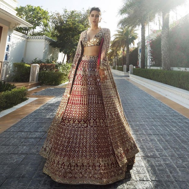 Sara Ali Khan unearths gliding and glorious affair in red and gold lehenga from Manish Malhotra's Nooraniyat collection