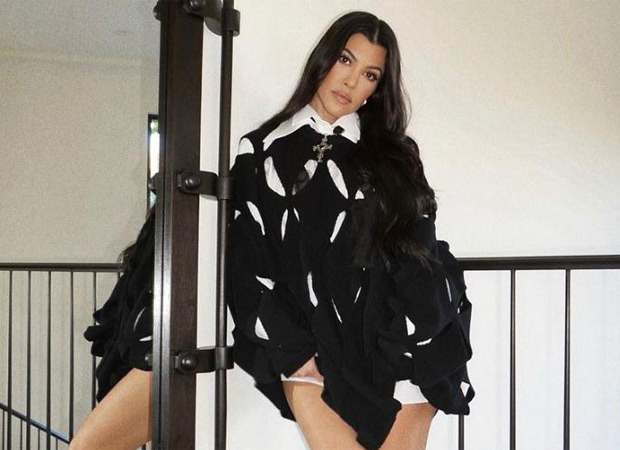 kourtney kardashian shirt dress Kourtney Kardashian puts on a very cheeky display as she suffers a wardrobe malfunction in an oversized shirt while visiting a farm in Australia