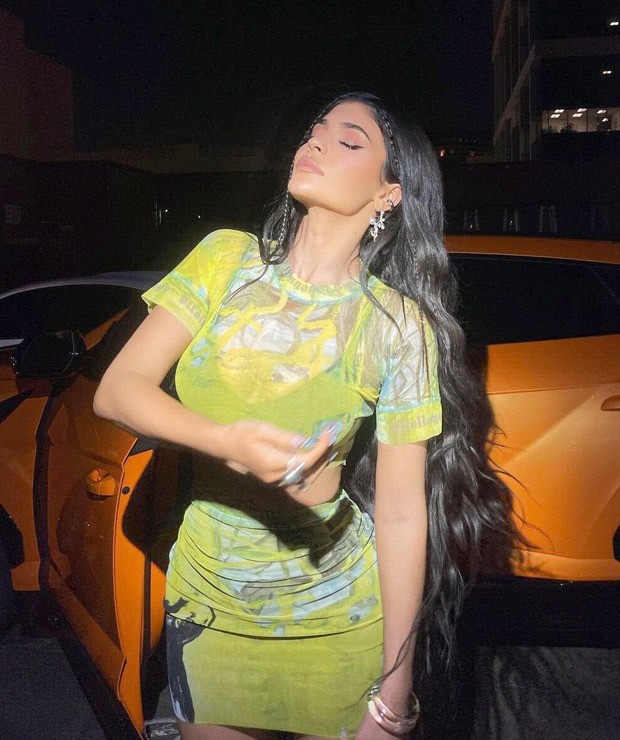 Kylie Jenner goes monotone in lime green mesh top and mini skirt poses with her Lamborghini Urus worth over Rs. 3.10 crores 3 Bollywood News Bollywood Hungama