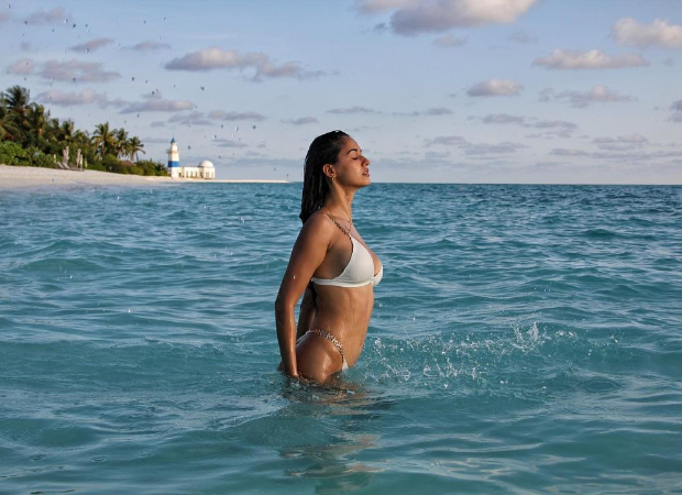 Disha Patani sets the temperature soaring skimpy white bikini in this beach photo