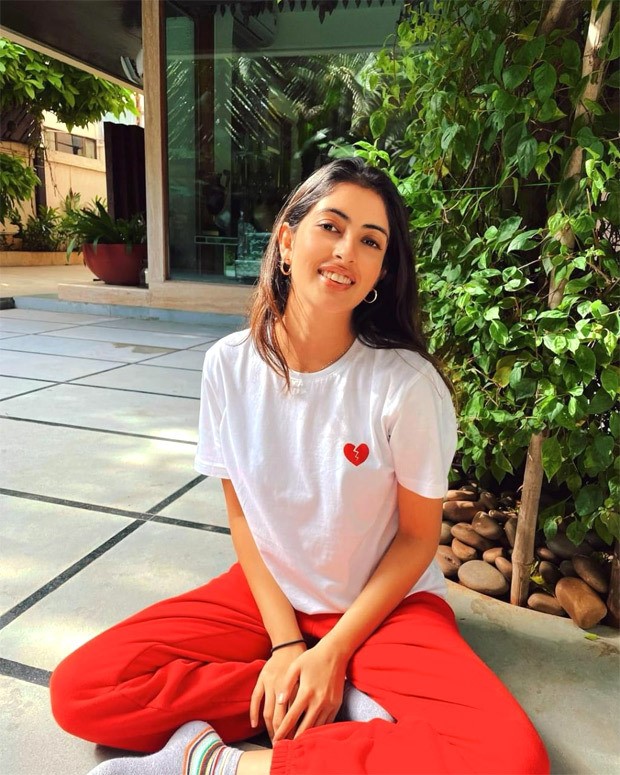 Premium Photo  Blonde woman in white shirt and red trousers