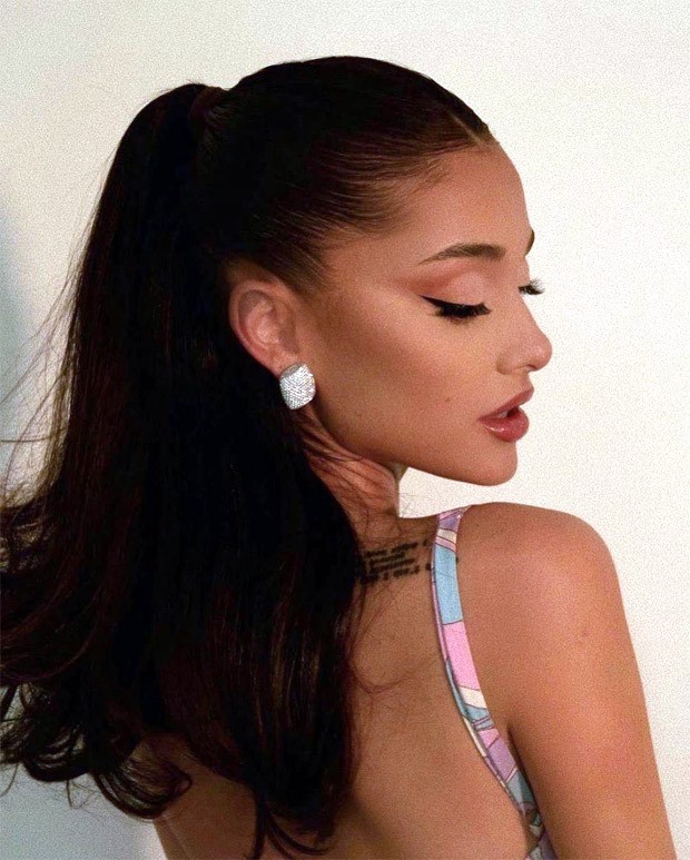 Newly married Ariana Grande stuns in black halter neck top and mini ...