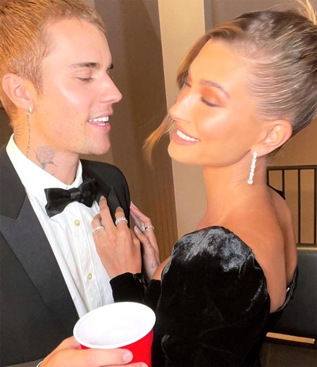 Justin Bieber looks dapper in black YSL tuxedo worth Rs. 2.14 lakh; wife Hailey Bieber stuns in lace Alessandra Rich thigh-high slit velvet dress