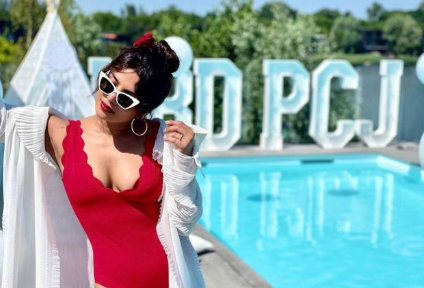 Priyanka Chopra enjoys sunny London weather in red plunging neckline swimsuit as Nick Jonas organises birthday party Priyanka Chopra enjoys sunny London weather in red plunging neckline swimsuit as Nick Jonas organises birthday party