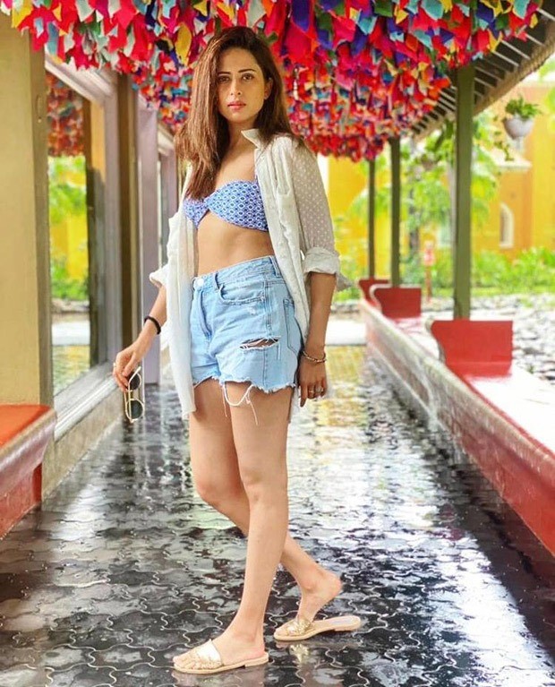 Sargun Mehta's off-duty look consists of a printed bralette, high waisted  denim shorts & white shirt : Bollywood News - Bollywood Hungama