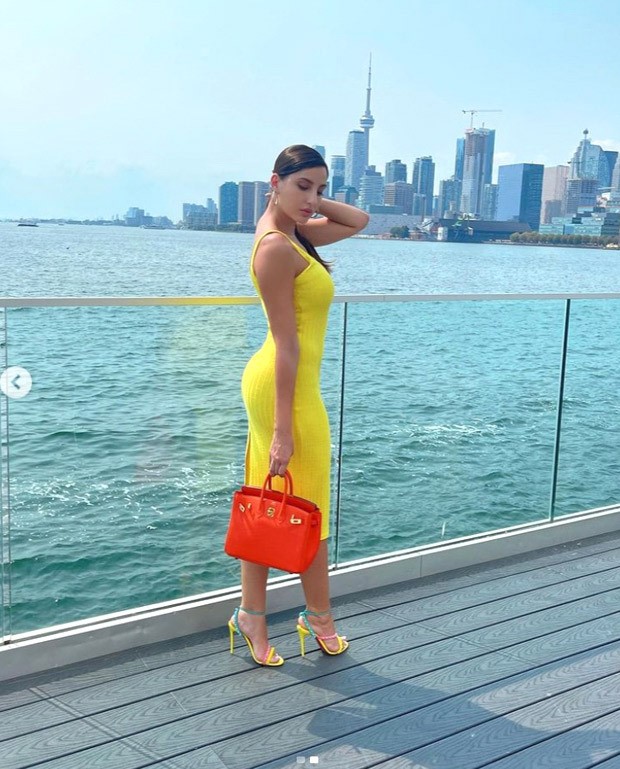 Nora Fatehi sizzles in bright yellow dress along with uber