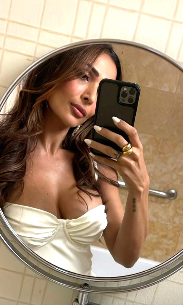 Malaika Arora is vision in pearl white strappy corset style thigh-high slit  dress : Bollywood News - Bollywood Hungama
