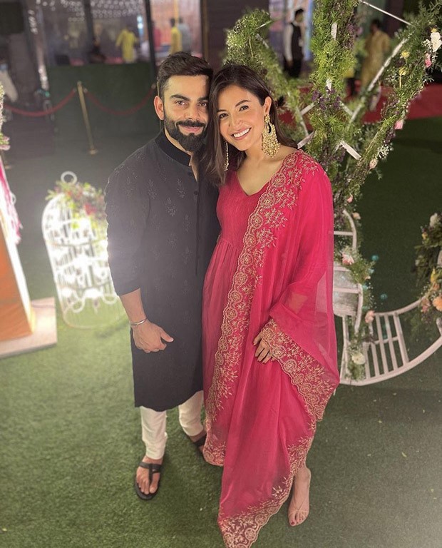 Anushka Sharma shares stunning pictures with husband Virat Kohli donning fuschia pink suit worth Rs. 16,900 from Glen Maxwell’s wedding
