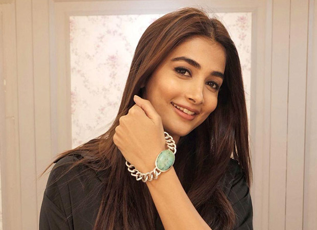 Pooja Hegde poses on the sets of Kabhi Eid Kabhi Diwali wearing a bracelet similar to that of co-star Salman Khan