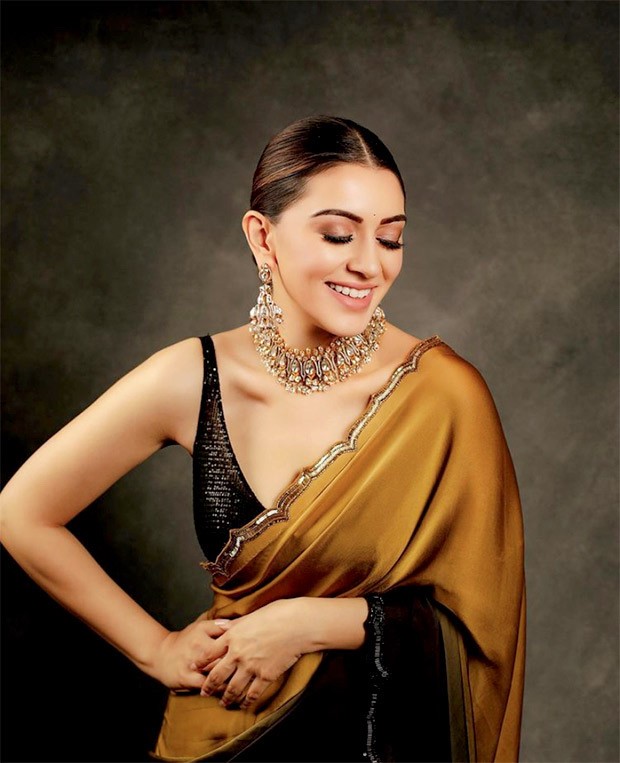 Hansika Motwani exudes royalty in stunning mustard black ombre saree worth Rs. 71,000 as she attends the audio launch of her film Maha