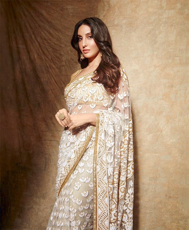 Nora Fatehi is a sight to behold in Manish Malhotra’s sheer floral ivory saree and sleeveless blouse Nora Fatehi is a sight to behold in Manish Malhotra’s sheer floral ivory saree and sleeveless blouse