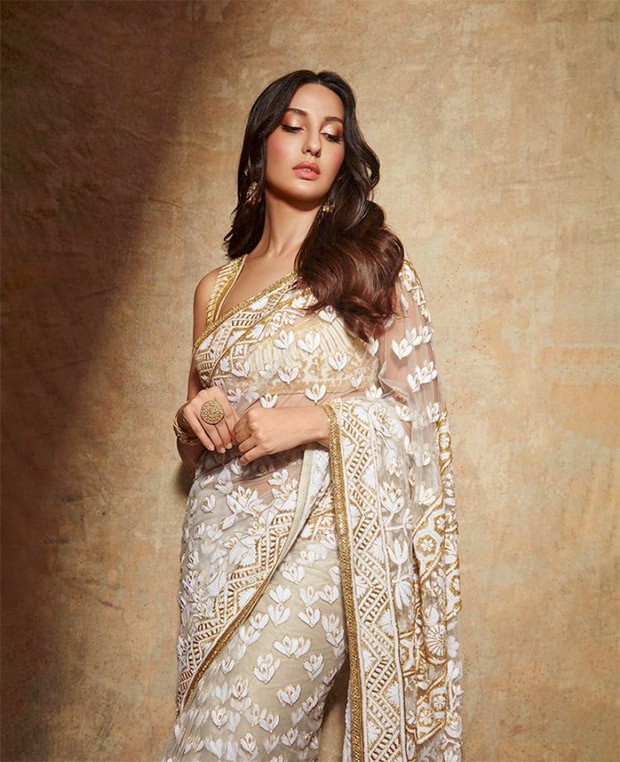 Nora Fatehi is a sight to behold in Manish Malhotra’s sheer floral ivory saree and sleeveless blouse Nora Fatehi is a sight to behold in Manish Malhotra’s sheer floral ivory saree and sleeveless blouse