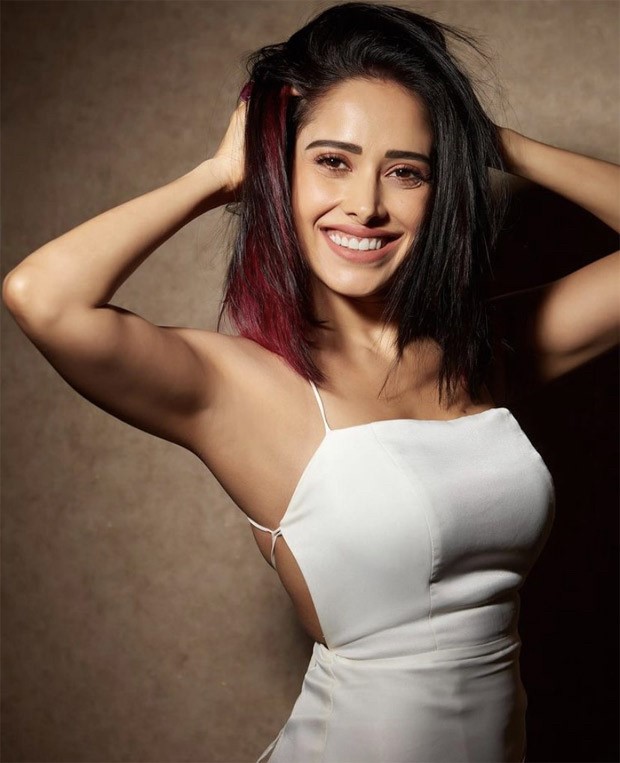 Nushrratt Bharuccha makes a statement in a chic white dress and  red-coloured hair streaks : Bollywood News - Bollywood Hungama