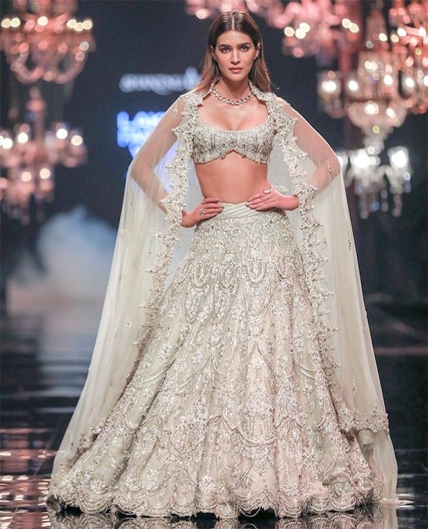 Kriti Sanon rules the runway on the opening day of FDCI X Lakmé Fashion Week 2022 while donning a glittering ivory lehenga by Shantanu & Nikhil