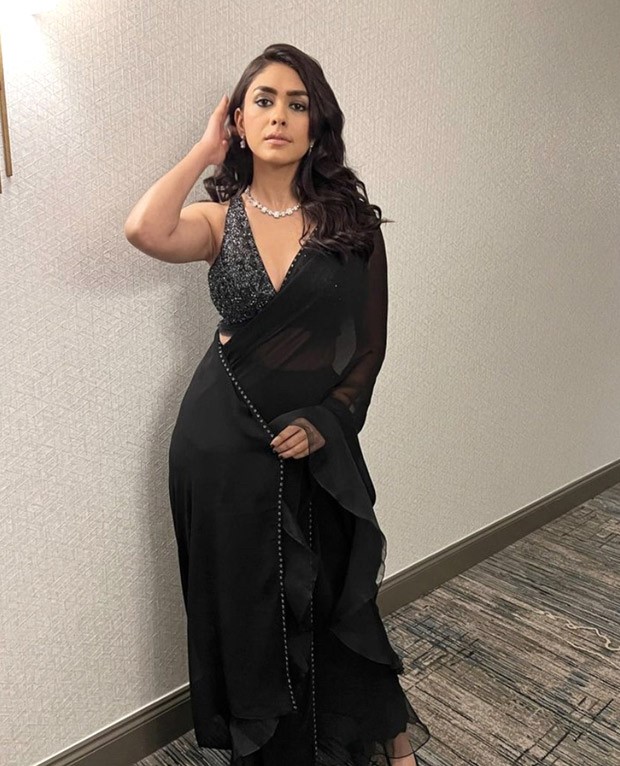 Mrunal Thakur looks like a bombshell in black saree and sequined black and silver blouse