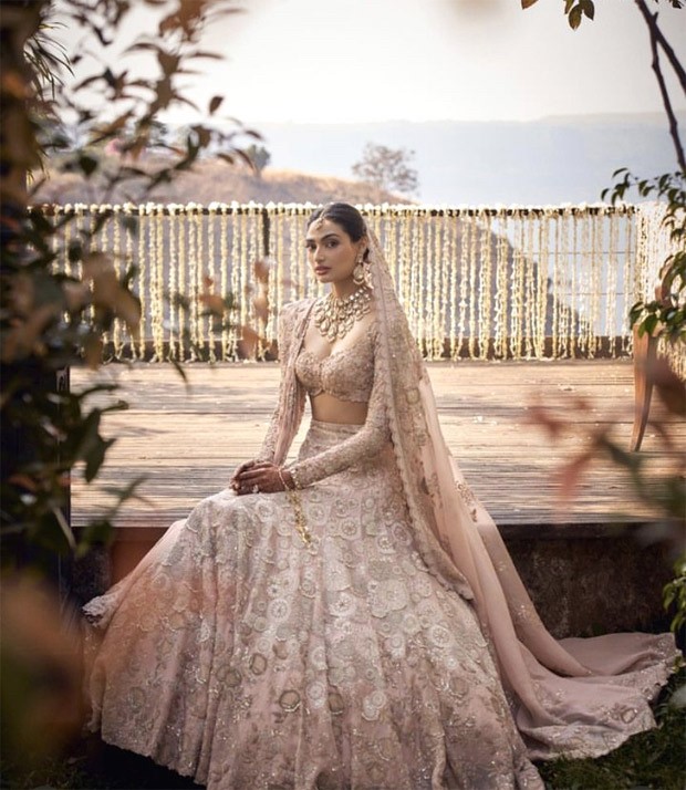 Athiya Shetty makes a vivacious bride in a blush pink lehenga by
