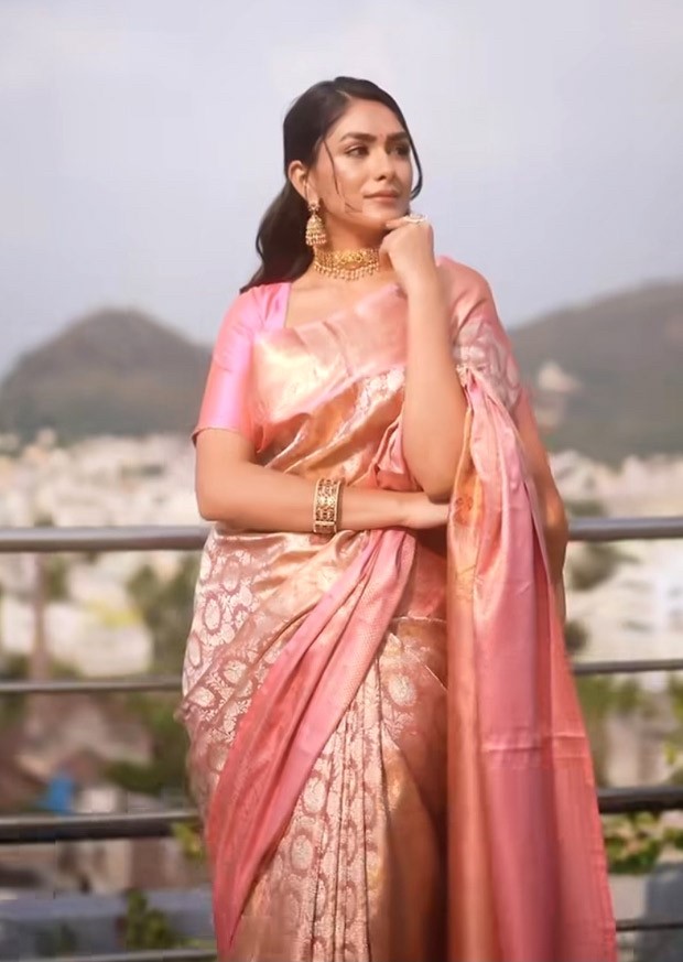 Mrunal Thakur, dressed in a blush pink brocade saree and with